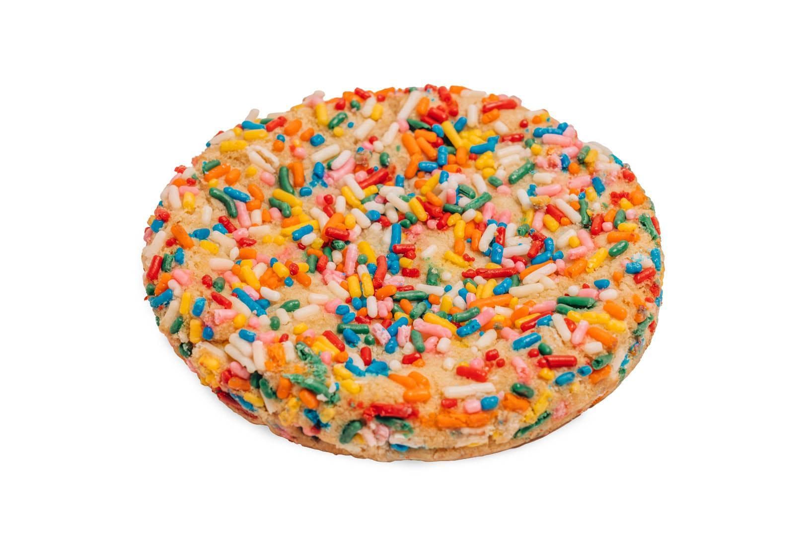 Sugar cookie covered in colorful sprinkles.